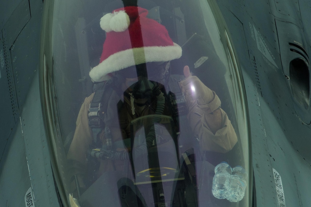 An F-16 Fighting Falcon receives fuel from a KC-10 Extender over Iraq, Dec. 25, 2016. Many pilots wore a traditional red “Santa” hat while flying on Christmas Day. F-16s are providing precision guided close air support during Combined Joint Task Force-Operation Inherent Resolve, a multinational effort to weaken and destroy Islamic State in Iraq and the Levant operations in the Middle East region and around the world. (U.S. Air Force photo | Senior Airman Tyler Woodward)