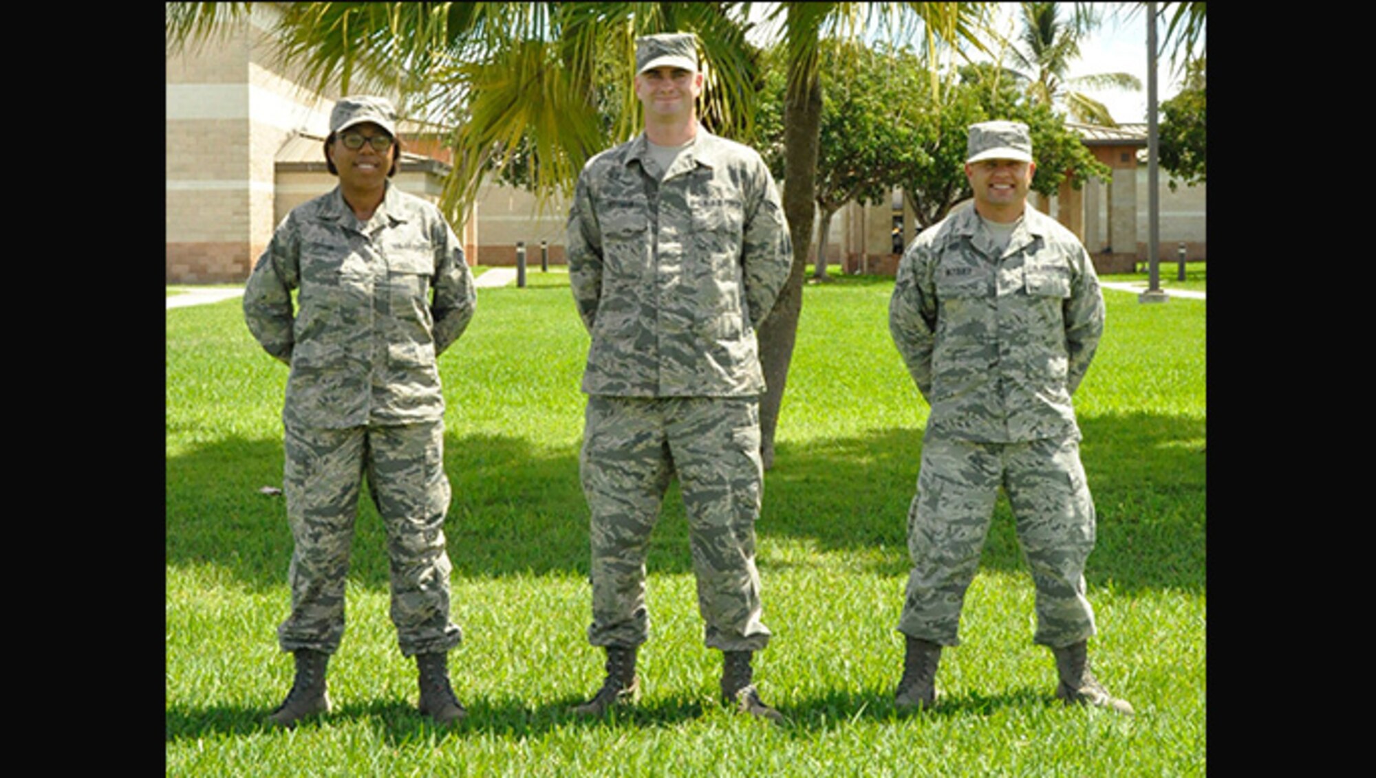 Staff Sgt. Kristy Taylor, left, Senior Airmen Michael Hoffman, center, and Isaias Vazquez, pose for a photo at Homestead Air Reserve Base, Florida Sept. 10, 2016. These three Airmen were selected to become officers through the Deserving Airman Program, which allows squadron commanders to hold a vacant officer position open to be filled by one of the enlisted Airmen selected to commission by a board. (U.S. Air Force photo by Staff Sgt. Desiree Moye)