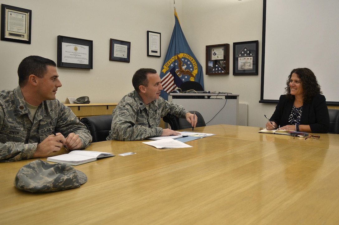 Nora Steigerwalt (left), Medical supply chain director of customer operations, meets with Lt. Col. Christopher Estridge (center) and Maj. Blake Smith, both Air Force medical service corps officers from the Defense Health Agency, at DLA Troop Support in Philadelphia Nov. 16.