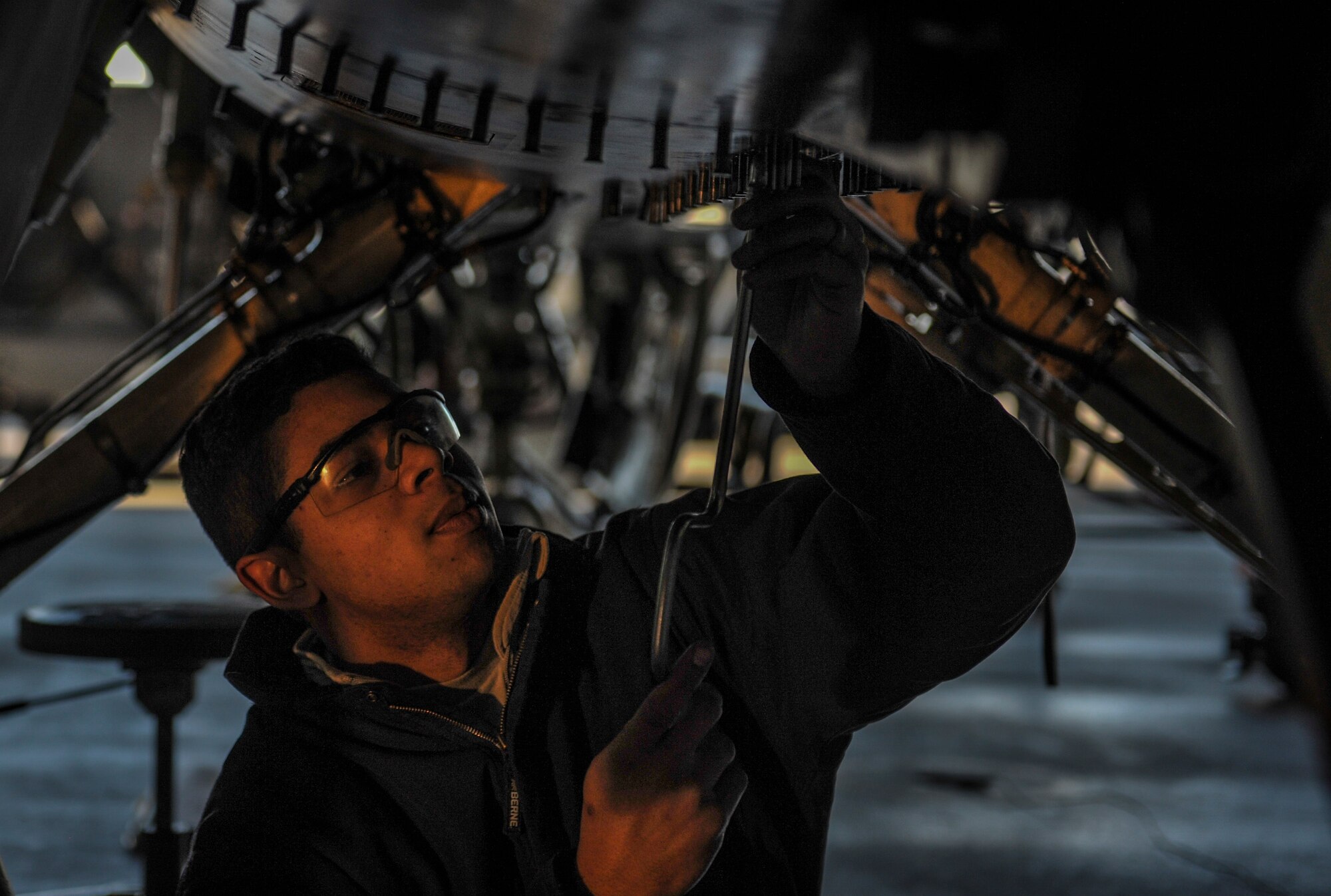 Airman 1st Class Angelo Borbon, 8th Maintenance Squadron inspection section team member, inspects the landing gear of an F-16 Fighting Falcon at Kunsan Air Base, Republic of Korea, Dec. 6, 2016.  Kunsan airmen work to employ airpower to deter aggression, preserve the Armistice and defend the Republic of Korea. (U.S. Air Force photo by Senior Airman Colville McFee/Released)