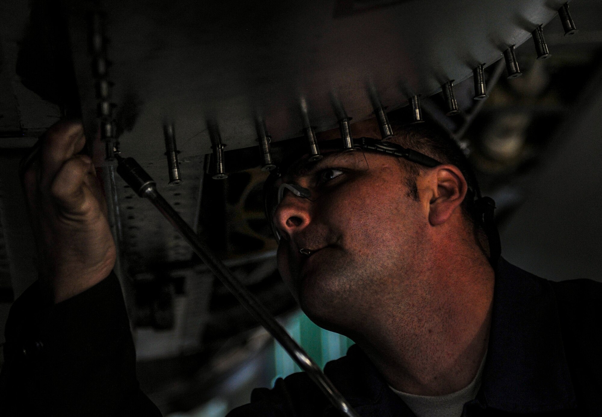 Staff Sgt. Christopher Freebes, 8th Maintenance Squadron phase dock floor chief, performs maintenance on an F-16 Fighting Falcon at Kunsan Air Base, Republic of Korea, Dec. 6, 2016. Kunsan airmen work to employ airpower to deter aggression, preserve the Armistice and defend the Republic of Korea. (U.S. Air Force photo by Senior Airman Colville McFee/Released)