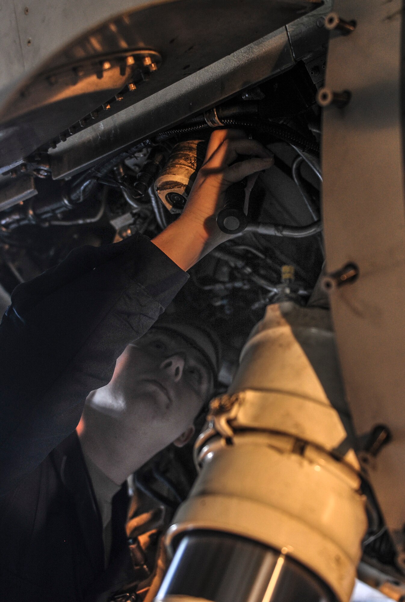 Airman 1st Class Nathaniel Winters, 8th Maintenance Squadron inspection team member, inspects the landing gear of an F-16 Fighting Falcon at Kunsan Air Base, Republic of Korea, Dec. 6, 2016. Phase inspections are performed on aircraft every 400 flight hours and involve procedural maintenance actions that require robust attention to detail. (U.S. Air Force photo by Senior Airman Colville McFee/Released)