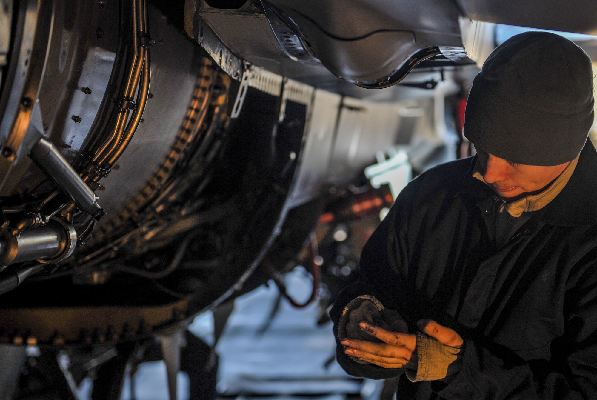 Senior Airman Shane Fortune, 8th Maintenance Squadron phase inspection team member, inspects a part of an F-16 Fighting Falcon at Kunsan Air Base, Republic of Korea, Dec. 6, 2016. Fortune works with a team of Airmen during phase inspections to ensure aircraft are prepared for flight. Phase inspections are performed on aircraft every 400 flight hours and involve procedural maintenance actions that require robust attention to detail. (U.S. Air Force photo by Senior Airman Colville McFee/Released)