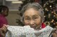 Chiyo, a Japanese elder, holds a gift from Misawa Airmen and families at the Harunaoka Old Age Home, Misawa City, Japan, Dec. 22, 2016. Chiyo celebrated her birthday for turning 84-years-old in December. The facility helps care for elderly in need by providing food and shelter. (U.S. Air Force photo by Airman 1st Class Sadie Colbert)