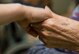 James Joiner III, left, son of Master Sgt. James Joiner, a 35th Civil Engineer Squadron explosives ordnance disposal technician, holds hand of Tanae, right, a Japanese elder at Harunaoka Old Age Home, Misawa City, Japan, Dec. 22, 2016. Many children walked around to meet members and talk with them. In 1984, the facility workers started to reach out to Misawa’s chapel to hold organized events every other month. (U.S. Air Force photo by Airman 1st Class Sadie Colbert)