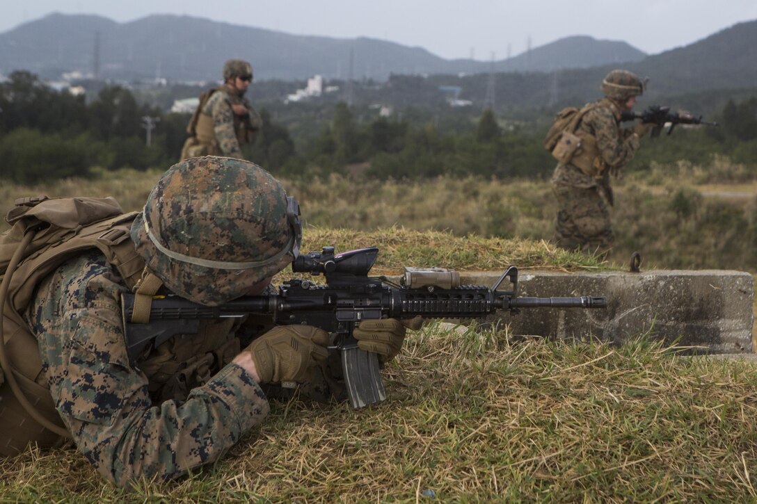 Lance Cpl. Patrick Achille, a mortarman with Battalion Landing Team, 2nd Battalion, 5th Marines, 31st Marine Expeditionary Unit, conduct live-fire and maneuver drills at Camp Hansen, Okinawa, Japan, Dec. 22, 2016. As the Marine Corps' only continuously forward-deployed unit, the 31st MEU air-ground-logistics team provides a flexible force, ready to perform a wide range of military operations, from limited combat to humanitarian assistance operations, through the Indo-Asia-Pacific region. Achille is a native of Daytona Beach, Florida. (U.S. Marine Corps photo by Cpl. Darien J. Bjorndal/Released)