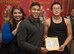 Kennedy Travis, left, wife of U.S. Air Force Senior Airman Lowell Travis, center, the 35th Civil Engineer Squadron heavy planner, accept a thank you card from Daiki Komata, a Shichinohe Ophanage member, at Shichinohe, Japan, Dec. 23, 2016. The 35th Civil Engineer Squadron Airmen gave 41 gifts to orphans who ranged from 2-years-old to 18-years-old. (U.S. Air Force photo by Airman 1st Class Sadie Colbert)