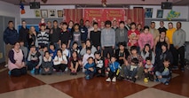 Airmen of the 35th Civil Engineer Squadron pose with Shichinohe Orphanage children at Shichinohe, Japan, Dec. 23, 2016. The squadron wanted to reach out beyond the city limits of Misawa, Japan, by helping those who did not have anyone to celebrate the holidays with. (U.S. Air Force photo by Airman 1st Class Sadie Colbert)
