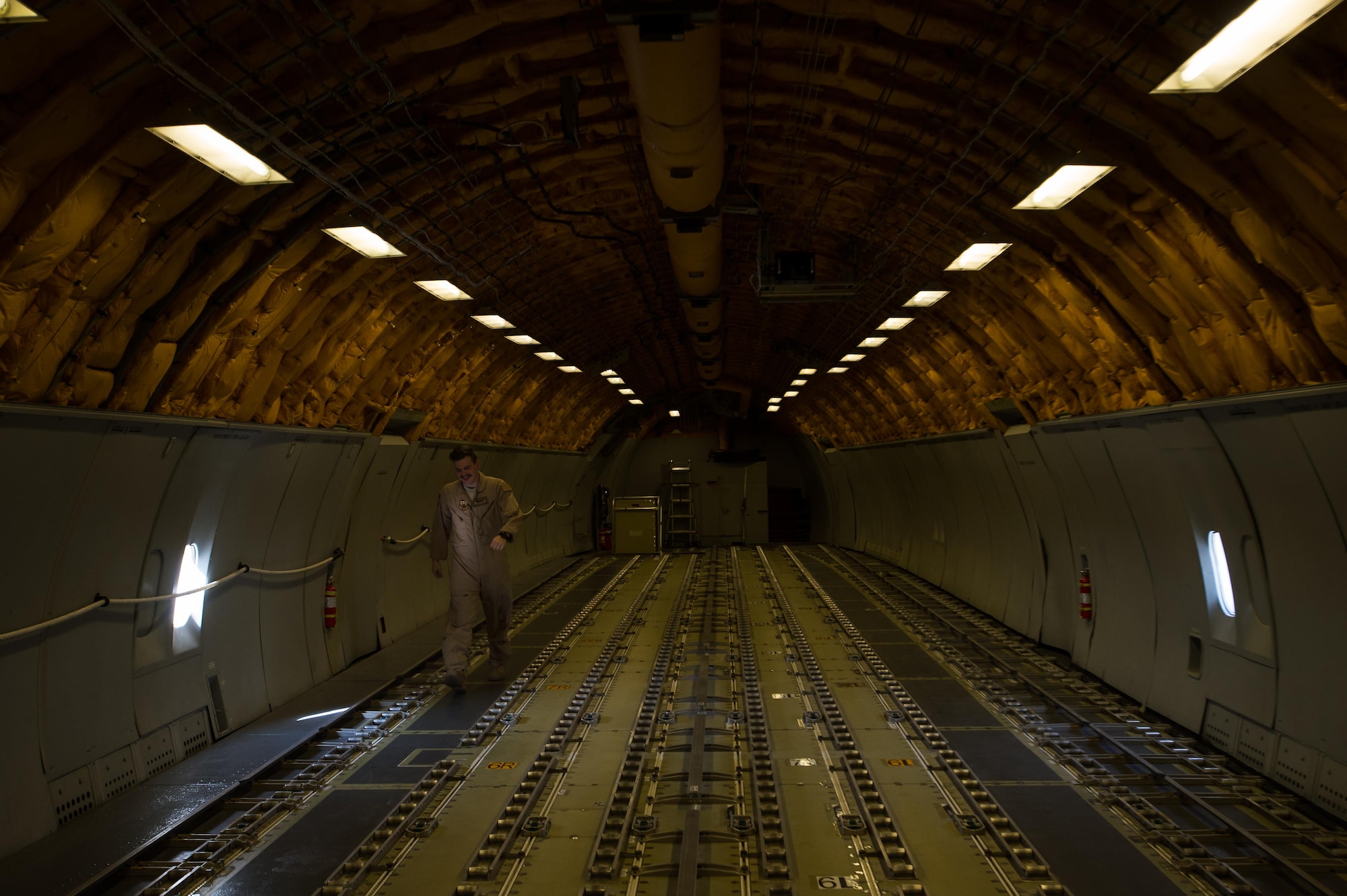 A 380th Air Expeditionary Wing KC-10 Extender boom operator Senior Airman Grant walks toward the cockpit after completing a preflight inspection in the boom pod at an undisclosed location in Southwest Asia, Dec. 25, 2016. 380 AEW KC-10 boom operators have successfully offloaded fuel to more than 5,000 Coalition receivers in support of Combined Joint Task Force-Operation Inherent Resolve since Oct. 2016. (U.S. Air Force photo/Senior Airman Tyler Woodward)