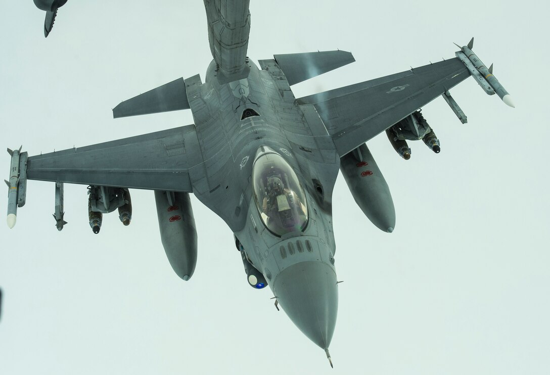 An F-16 Fighting Falcon disconnects from a KC-10 Extender after receiving fuel over Iraq, Dec. 25, 2016. F-16s are providing precision guided close air support during Combined Joint Task Force-Operation Inherent Resolve, a multinational effort to weaken and destroy Islamic State in Iraq and the Levant, operations in the Middle East region and around the world. (U.S. Air Force photo/Senior Airman Tyler Woodward)