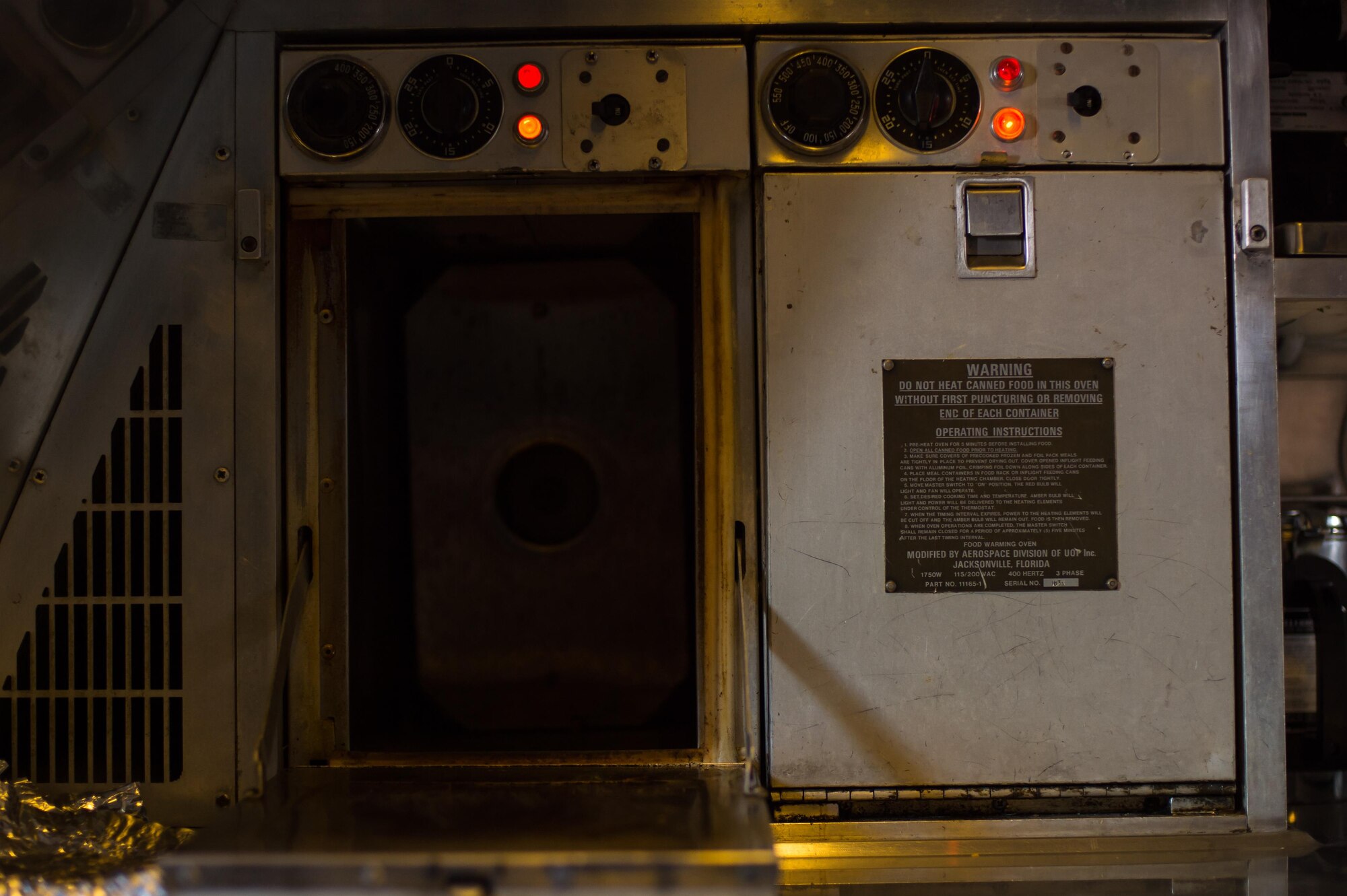 A KC-10 Extender oven is heated for a holiday meal during a sortie supporting Combined Joint Task Force-Operation Inherent Resolve over Iraq, Dec. 25, 2016. During the flight, crew members ate pizza, pita bread, chocolate chip cookies and pita bread. (U.S. Air Force photo/Senior Airman Tyler Woodward)