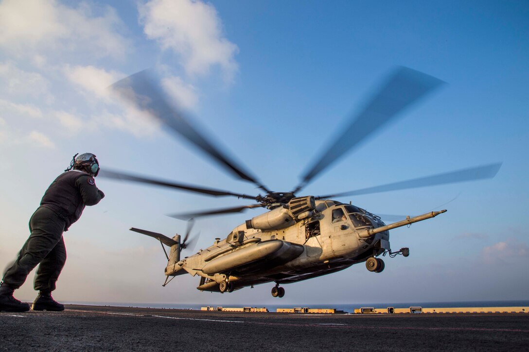 A U.S. Marine CH-53E Super Stallion, assigned to the Ridge Runners of Marine Medium Tiltrotor Squadron 163, takes off from the flight deck of the amphibious assault ship USS Makin Island during a helo-borne raid as part of Exercise Alligator Dagger, in the Gulf of Aden, Dec. 21, 2016. The unilateral exercise provides an opportunity for the Makin Island Amphibious Ready Group and 11th Marine Expeditionary Unit to train in amphibious operations within the U.S. 5th Fleet area of operations. The 11th MEU is currently supporting U.S. 5th Fleet’s mission to promote and maintain stability and security in the region.