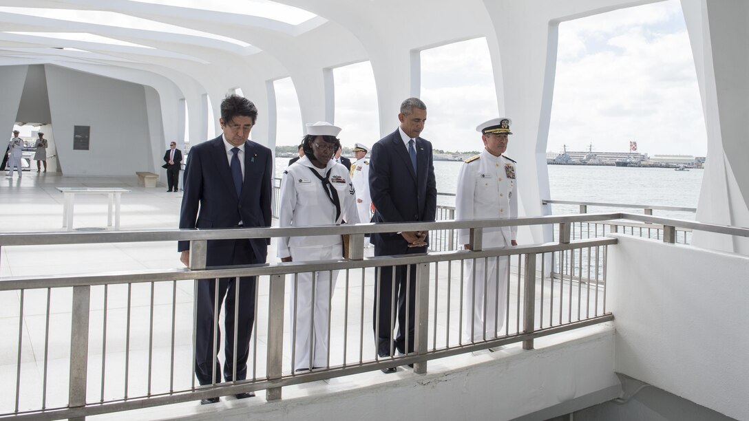 President Barack Obama and Japanese Prime Minister Shinzo Abe join Navy Adm. Harry B. Harris Jr., commander of U.S. Pacific Command, and Petty Officer 2nd Class Michelle Wrabley aboard the USS Arizona Memorial in Pearl Harbor, Hawaii, Dec. 27, 2016, to honor the service members killed during the Dec. 7, 194, attack. Abe is the first Japanese prime minister to visit the USS Arizona Memorial. Navy photo by Petty Officer 1st Class Jay Chu