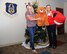 Alice Bessette, president, Leadership Tampa Bay (on right) delivers holiday cheer to the 927th Air Refueling Wing. During the holiday season, the 927th Air Refueling Wing Airman Family Readiness Office here, represented by Master Sgt. Marchell Green(on left) creates a Wingman Tree, a tree that Wing members can select an angel representing an Airman and his or her family that are in need, this year the local community also helped answer the need. (U.S. Air Force photo/Tech. Sgt. Peter Dean) 