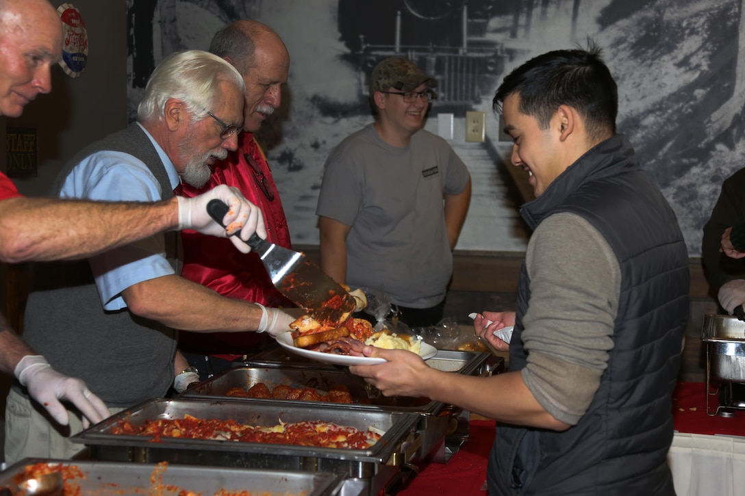 A Sailor is served food during the Single Marine Program’s annual Christmas dinner at the Roadhouse aboard Marine Corps Air Station Cherry Point, N.C., Dec. 25, 2016. The free homemade dinner was open to all single and unaccompanied Marines and Sailors. Activities went on all day at the Roadhouse to include holiday movies, a mega gingerbread house construction and white elephant gift exchange with gifts provided by the SMP. (Marine Corps photo by Cpl. Jason Jimenez/ Released)