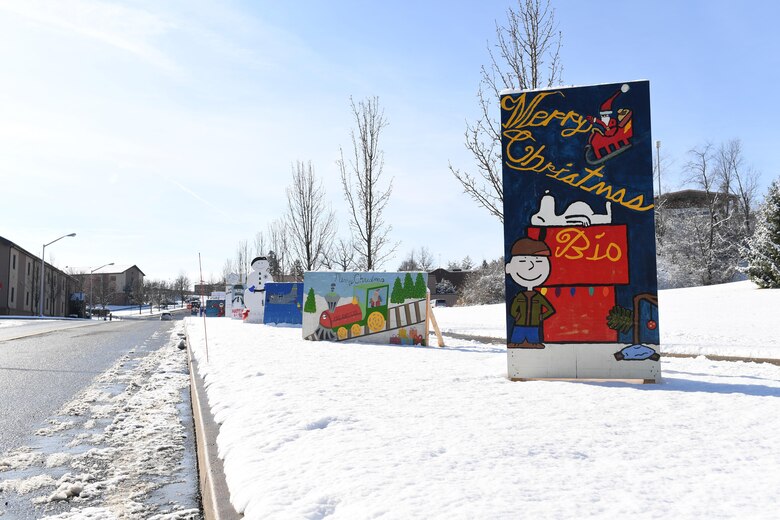 Signs decorate the sidewalk wishing base members a happy holiday Dec. 14, 2016, at the Pittsburgh International Airport Air Reserve Station, Pa. Signs from squadrons and groups across the base are a holiday tradition at the Pittsburgh IAP ARS. (U.S. Air Force photo by Senior Airman Beth Kobily)