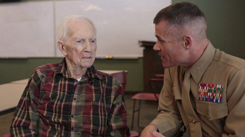Col. Thomas M. Fahy (right) speaks with retired 1st Lt. John J. O’Leary (left), a Marine veteran of World War II, at the Evergreen Community of Johnson County, Olathe, Kan., Dec. 21, 2016. O’Leary fought on Guam and witnessed the bombardment of Iwo Jima as a member of 3rd Joint Assault Signal Company. He celebrated his 100th birthday on Dec. 23. (U.S. Marine Corps photo by Sgt. Ian Leones)