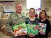 The holidays can be a tough time of the year for some unit members who may be separated from their friends and family by long distances or special situations.  For several years now, members of the 932nd Airlift Wing have raised money and donated food and toy items to the 932nd Airman and Family Readiness office, which are then redistributed to those wing members most in need during this end of year holiday timeframe.  Commander of the 932nd Airlift Wing, Col. Jonathan Philebum (left), stopped by to help Deb Teague (center), and his spouse Joann Philebaum (right), on December 22, 2016, at Scott Air Force Base, Illinois.  Many individuals and squadrons gave money over several months, allowing the unit to give out 61 food baskets and some gift cards as needed between Thanksgiving and Christmas to Airmen of the 932nd, just another small example of leading and taking care of people.  (U.S. Air Force photo by Lt. Col. Stan Paregien)