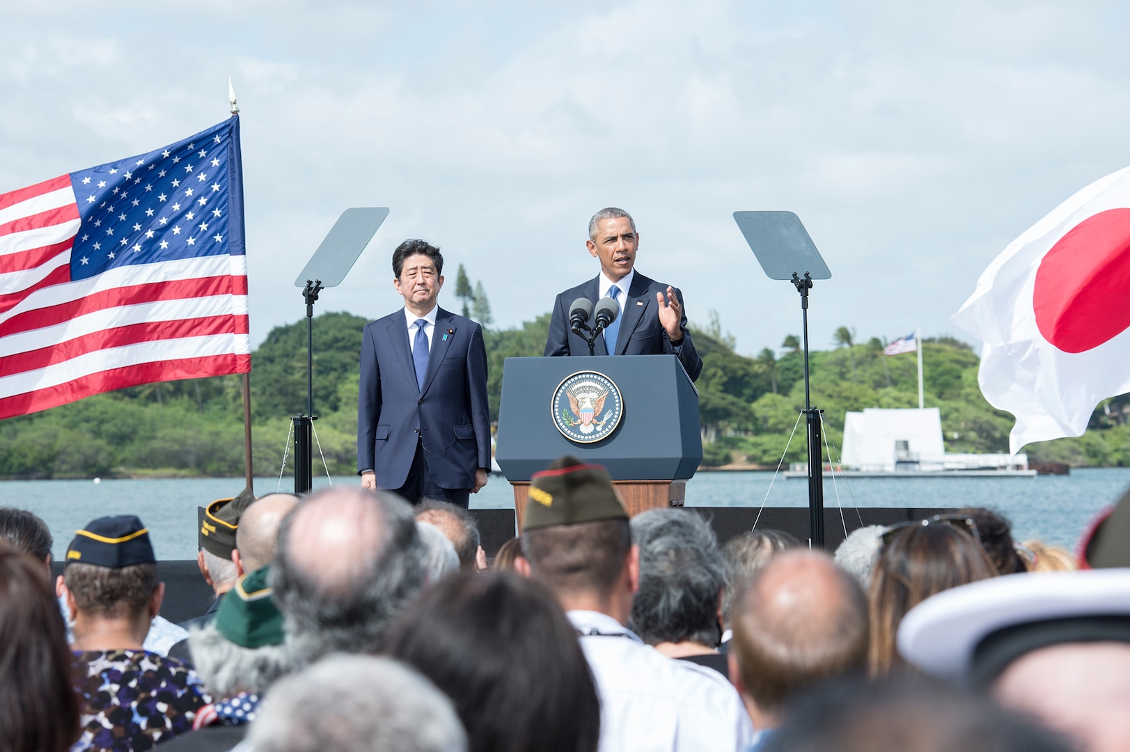 On Dec. 27, 2016, U.S. President Barack Obama speaks on Kilo Pier at Joint Base Pearl Harbor-Hickam while Japanese Prime Minister looks on. President Obama described the U.S.-Japan alliance as the cornerstone of peace and stability in the Asia-Pacific and a force for progress around the globe.