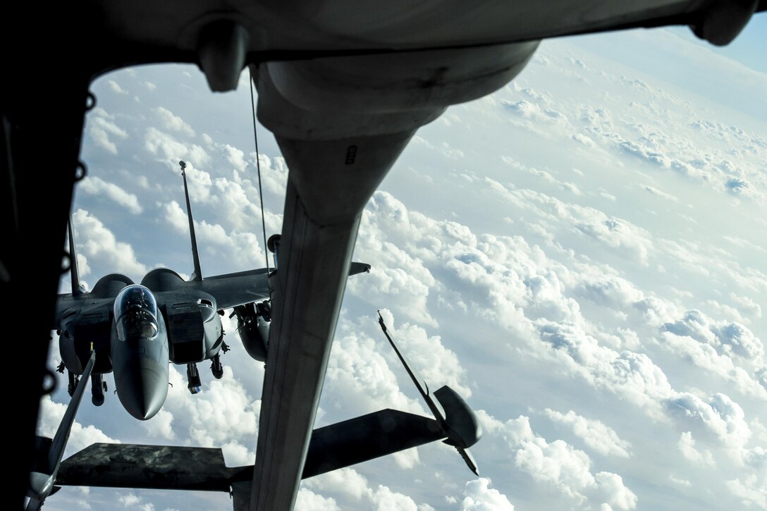 An F-15E Strike Eagle prepares to receive fuel from a KC-10 Extender over Iraq, Dec. 25, 2016. F-15s are providing close air support during Operation Inherent Resolve, a multinational effort to weaken and destroy the Islamic State in Iraq and the Levant in the Middle East region and around the world. Air Force photo by Senior Airman Tyler Woodward