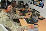 Pfc. Elyas Rosellini, an M1 armor crewman with the 1st Battalion, 67th Armored Regiment, moves his virtual avatar through a computer exercise during the second phase of squad overmatch training at Camp Buehring, Kuwait Dec. 14, 2016. The unique training opportunity incorporated a multi-platform teaching approach built on existing Army warrior skills training programs with detailed focus on improving situational awareness, psychological resilience, teamwork, tactical combat casualty care, and human performance enhancement. (U.S. Army photo by Sgt. Aaron Ellerman)