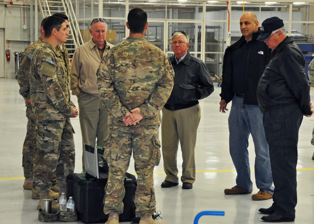 Retired former 919th Special Operations Wing leaders observe a combat aviation advisor demonstration at Duke Field, Fla., Dec. 16.  Ten of the wing’s retired former leaders and members were invited to tour the base and receive updates on the Air Force Reserve unit’s rapidly evolving mission sets. (U.S. Air Force photo/Dan Neely)