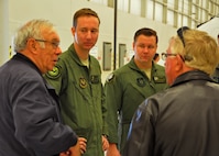 Retired Col. Rick Champion, a former 919th Special Operations Group commander, visits with aircrew members Capt. Steven Glowacki  of the 524th Special Operations Squadron, left,  and Staff Sgt. Parker Christianson of the 859th SOS at Duke Field, Fla., Dec. 16.  Ten of the 919th Special Operations Wing's retired former leaders and members were invited to tour the base and receive updates on the Air Force Reserve unit’s rapidly evolving mission sets. (U.S. Air Force photo/Dan Neely)