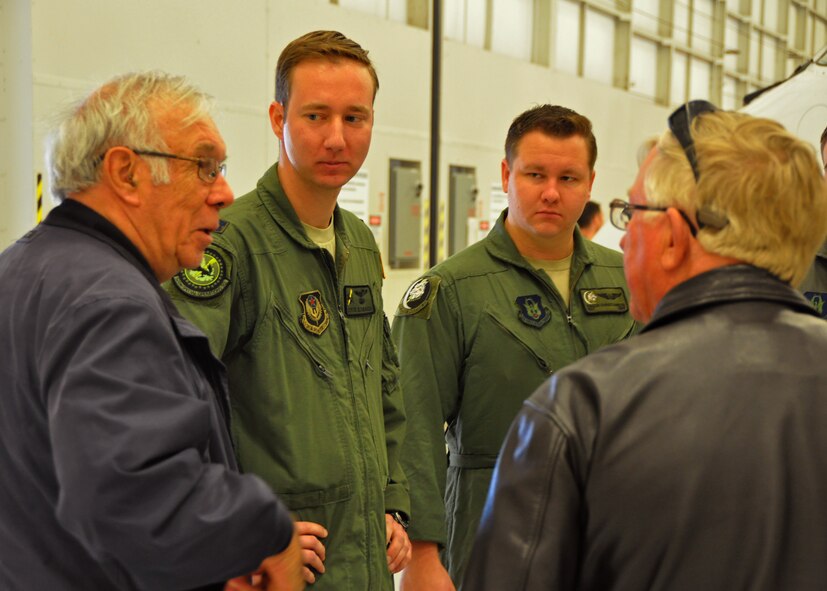 Retired Col. Rick Champion, a former 919th Special Operations Group commander, visits with aircrew members Capt. Steven Glowacki  of the 524th Special Operations Squadron, left,  and Staff Sgt. Parker Christianson of the 859th SOS at Duke Field, Fla., Dec. 16.  Ten of the 919th Special Operations Wing's retired former leaders and members were invited to tour the base and receive updates on the Air Force Reserve unit’s rapidly evolving mission sets. (U.S. Air Force photo/Dan Neely)