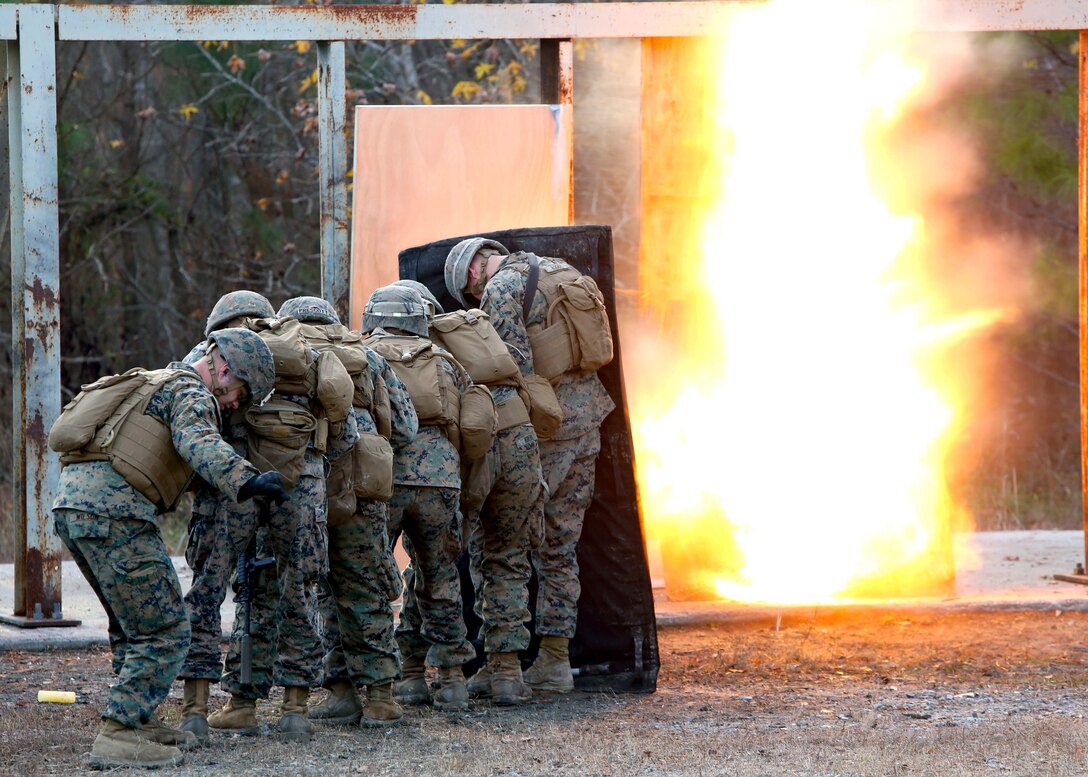 Marines take cover while setting off a detonation cord linear charge for an urban assault breaching range during a deployment for training exercise at Fort Pickett, Va., Dec. 8, 2016. The range was an opportunity for the Marines to practice the fundamentals of their job in an assault breaching. The Marines are with Charlie Company, 2nd Combat Engineer Battalion. (U.S. Marine Corps photo by Sgt. Clemente C. Garcia)