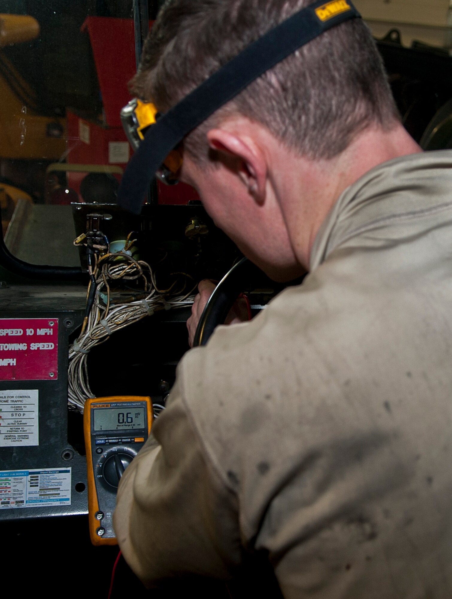 Airman 1st Class Brennan Walley, 5th Logistics Readiness Squadron vehicle maintenance technician, tests an electrical circuit at Minot Air Force Base, N.D., Dec. 14, 2016. Airmen in the 5th LRS special purpose shop are responsible for servicing all Minot AFB vehicles to ensure base operations continue running smoothly. (U.S. Air Force photo/Airman 1st Class Jonathan McElderry)