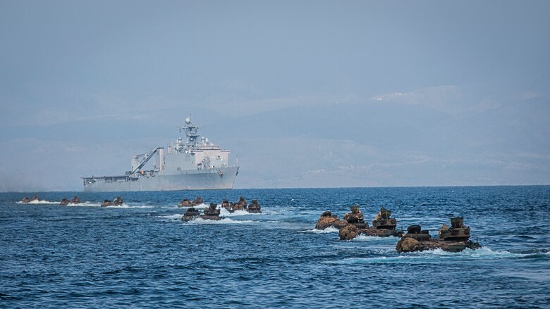 U.S. Marines with Battalion Landing Team, 1st Battalion, 4th Marines, 11th Marine Expeditionary Unit, advance toward the dock landing ship USS Comstock via amphibious assault vehicles after completing training for Exercise Alligator Dagger at Arta Beach, Djibouti, Dec. 21, 2016. AAVs are armored amphibious vehicles, capable of transporting Marines via land and sea. The 11th MEU provides a sea-based Marine Air-Ground Task Force capable of conducting amphibious operations to humanitarian assistance. The unilateral exercise provides an opportunity for the Makin Island Amphibious Ready Group and 11th MEU to train in amphibious operations within the U.S. 5th Fleet area of operations. The 11th MEU is currently supporting U.S. 5th Fleet’s mission to promote and maintain stability and security in the region. 