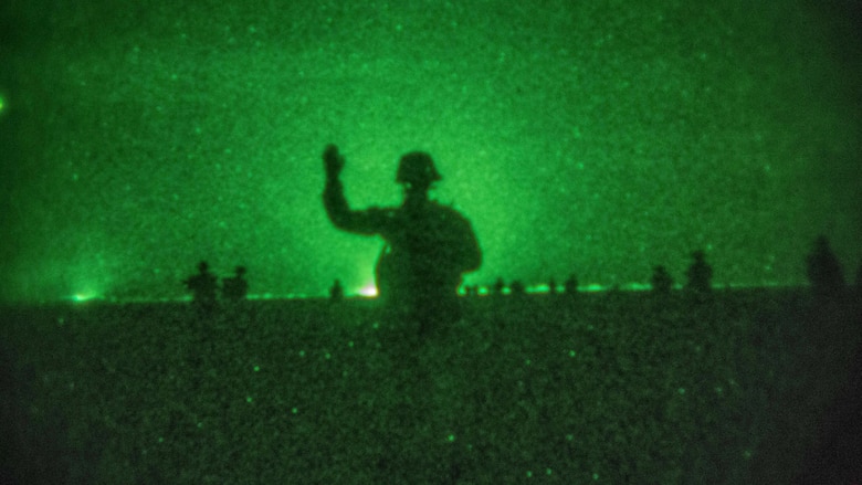 A U.S. Marine with Company C, Battalion Landing Team 1st Bn., 4th Marines, 11th Marine Expeditionary Unit, gives the signal to advance onto the objective area during a helo-borne raid as part of Exercise Alligator Dagger in Djibouti, Dec. 22, 2016. The raid involved Marines inserting onto an objective via MV-22 Ospreys and CH-53E Super Stallions, neutralizing simulated enemy threats onsite, and performing a thorough site exploitation of enemy intelligence before extracting all forces from the area, along with apprehended high-value individuals. The unilateral exercise provides an opportunity for the Makin Island Amphibious Ready Group and 11th MEU to train in amphibious operations within the U.S. 5th Fleet area of operations. The 11th MEU is currently supporting U.S. 5th Fleet’s mission to promote and maintain stability and security in the region.