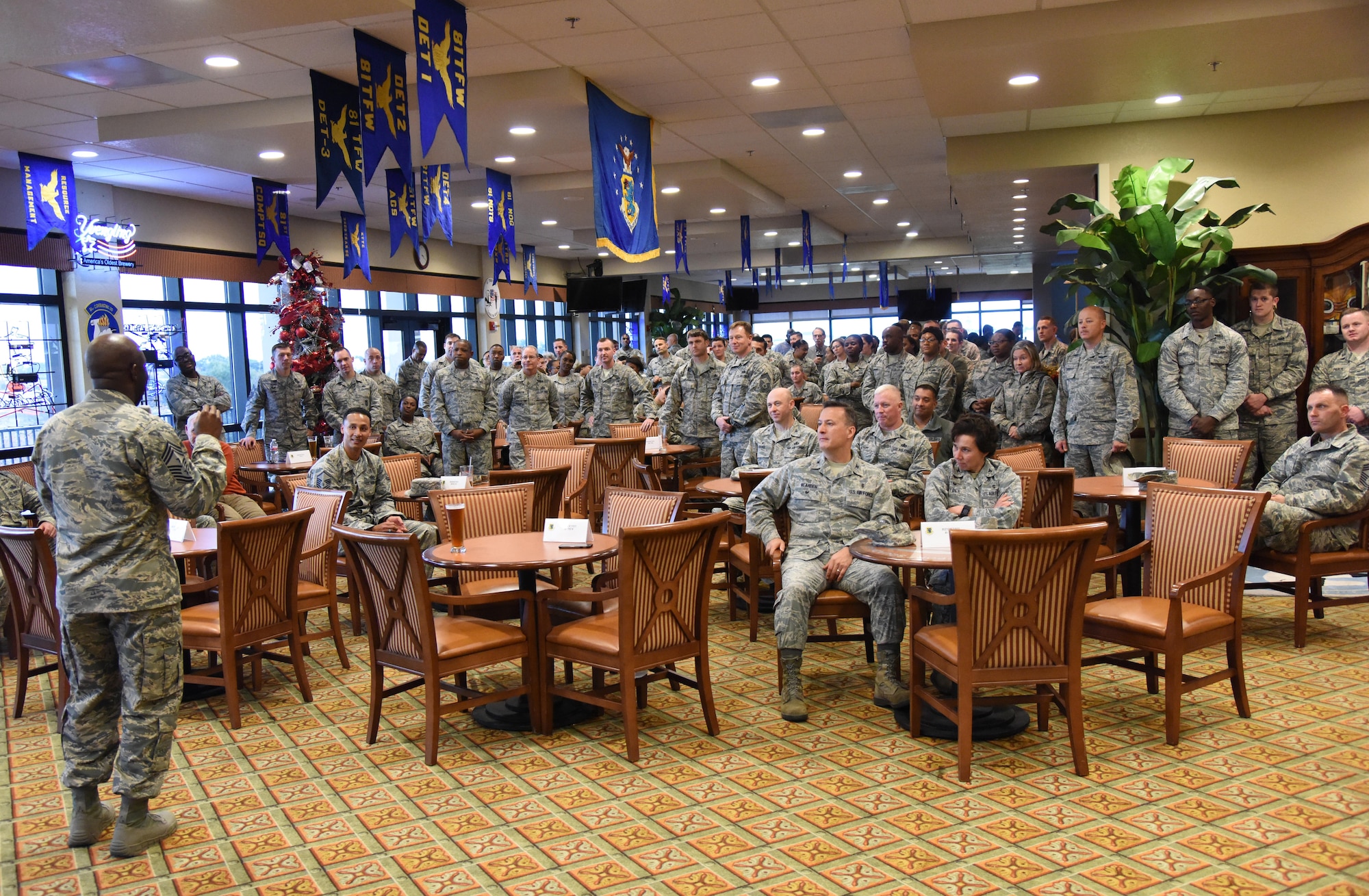 Chief Master Sgt. Vegas Clark, 81st Training Wing command chief, delivers remarks during a chief master sergeant-select recognition ceremony at the Bay Breeze Event Center Dec. 8, 2016, on Keesler Air Force Base, Miss. He recognized three Keesler senior NCOs, Senior Master Sgts. Timothy Carentz, 81st Medical Operations Squadron superintendent, Jeffrey Bankoske, Mathies NCO Academy director of education, and Larry Jackson, 81st Operations Support Flight superintendent, for their selection to join the top 1 percent of the Air Force’s enlisted force. (U.S. Air Force photo by Kemberly Groue)