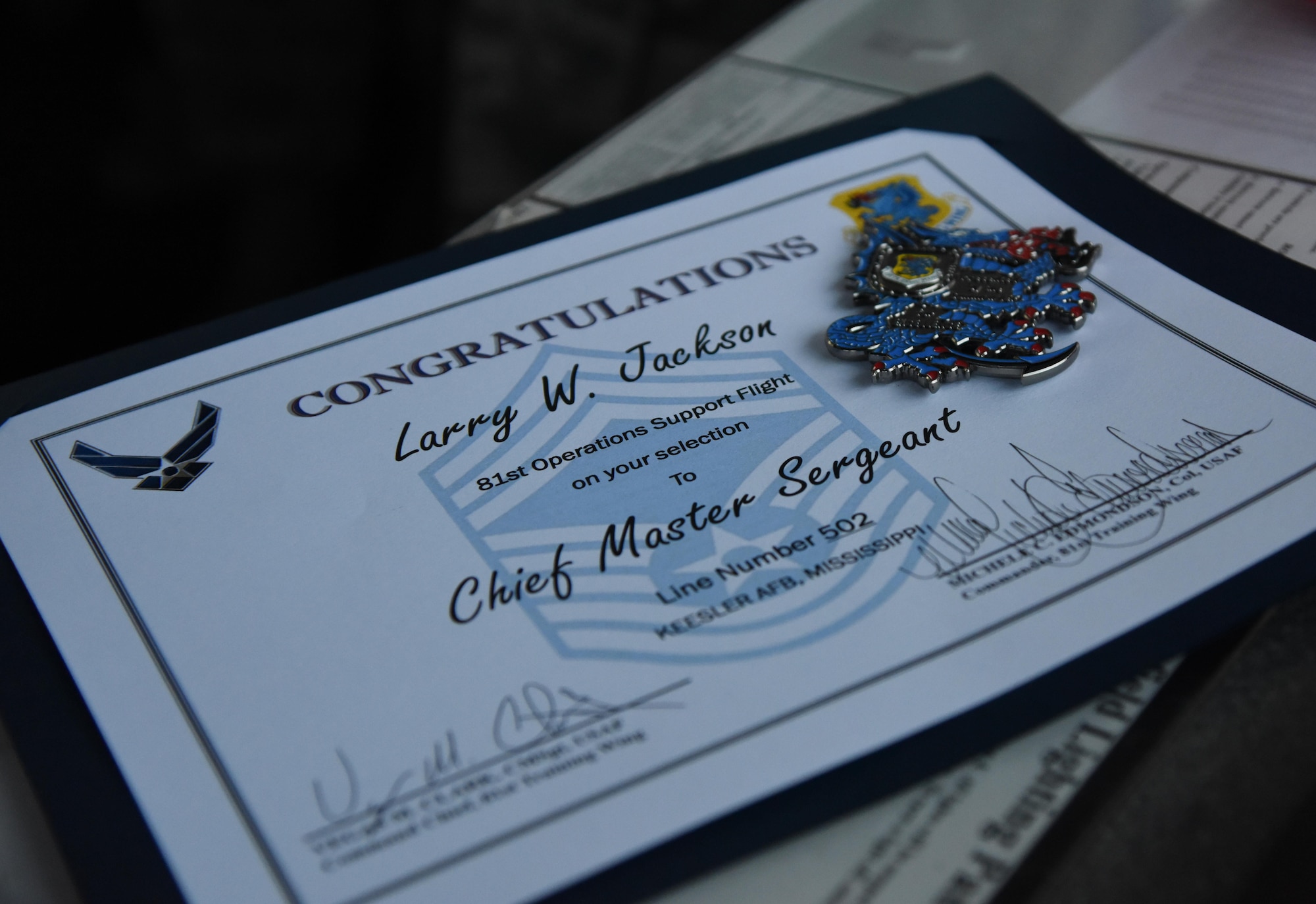 A promotion certificate for Senior Master Sgt. Larry Jackson, 81st Operations Support Flight superintendent, sits on display at the air traffic control tower Dec. 14, 2016, on Keesler Air Force Base, Miss. Base leadership visited the work centers of three Keesler senior NCOs to recognize and congratulate them for their selection to join the top 1 percent of the Air Force’s enlisted force. (U.S. Air Force photo by Kemberly Groue)