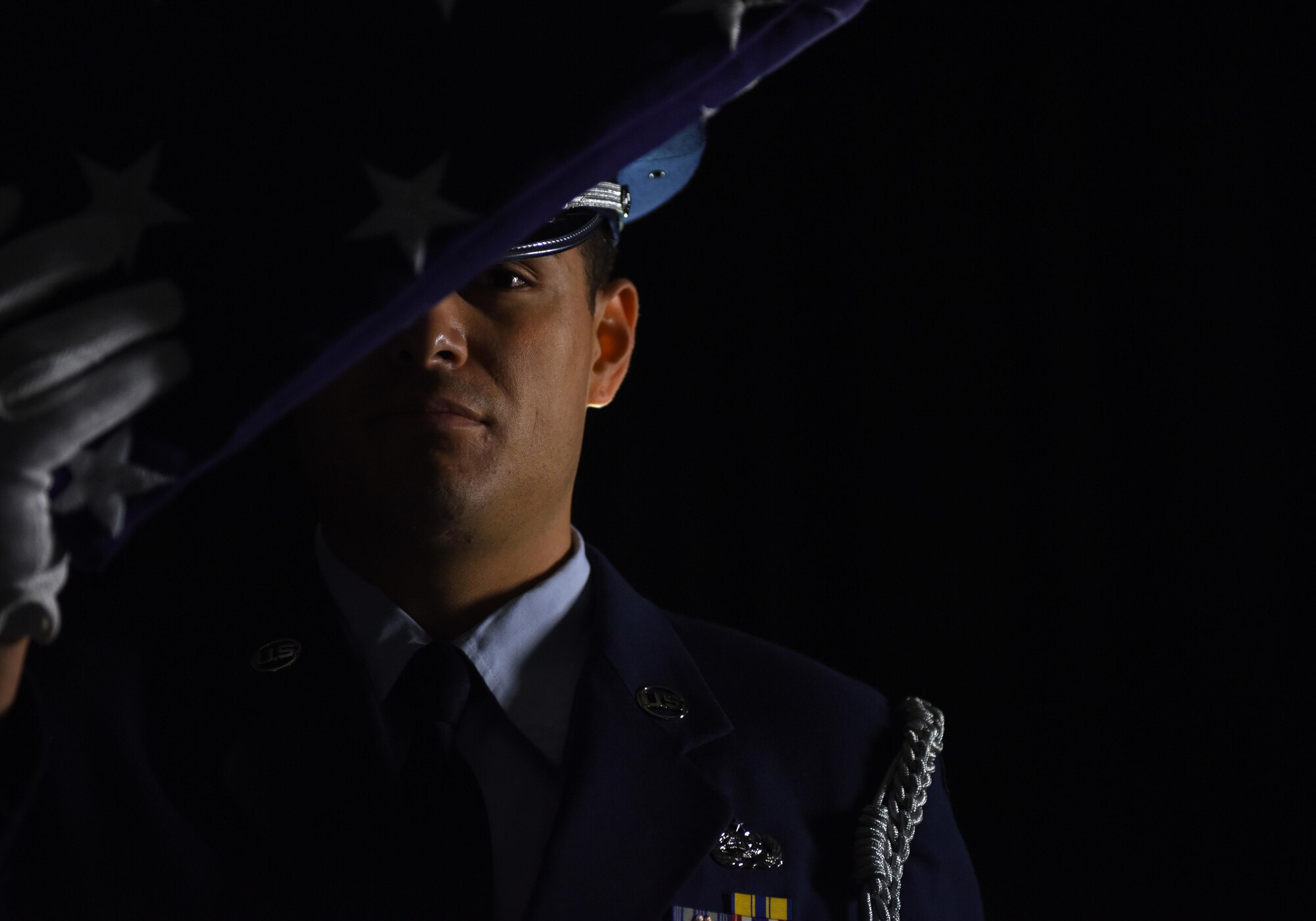 Staff Sgt. Anthony O’Conner-Geiling, 81st Training Wing honor guardsman, holds a folded U.S. flag Nov. 28, 2016, on Keesler Air Force Base, Miss. O’Conner-Geiling has spent five years on base honor guard units at Hill AFB, Utah, and Keesler, performing the duties of a ceremonial guardsman. He has participated in more than 280 details over a combined 213,000 square miles, covering two-thirds of Utah, southern Idaho, eastern Nevada, western Wyoming, southern Mississippi and southern Louisiana. (U.S. Air Force photo by Senior Airman Holly Mansfield)