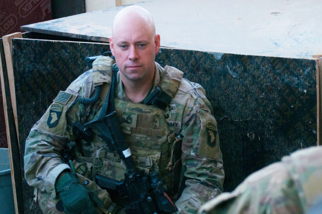 Army Sgt. 1st Class Brian Bailey, the first sergeant of Company A, 1st Battalion 26th Infantry Regiment, Task Force Strike, 2nd Brigade Combat Team, 101st Airborne Division (Air Assault), waits for soldiers to arrive to a security patrol briefing in northern Iraq, Dec. 7, 2016.