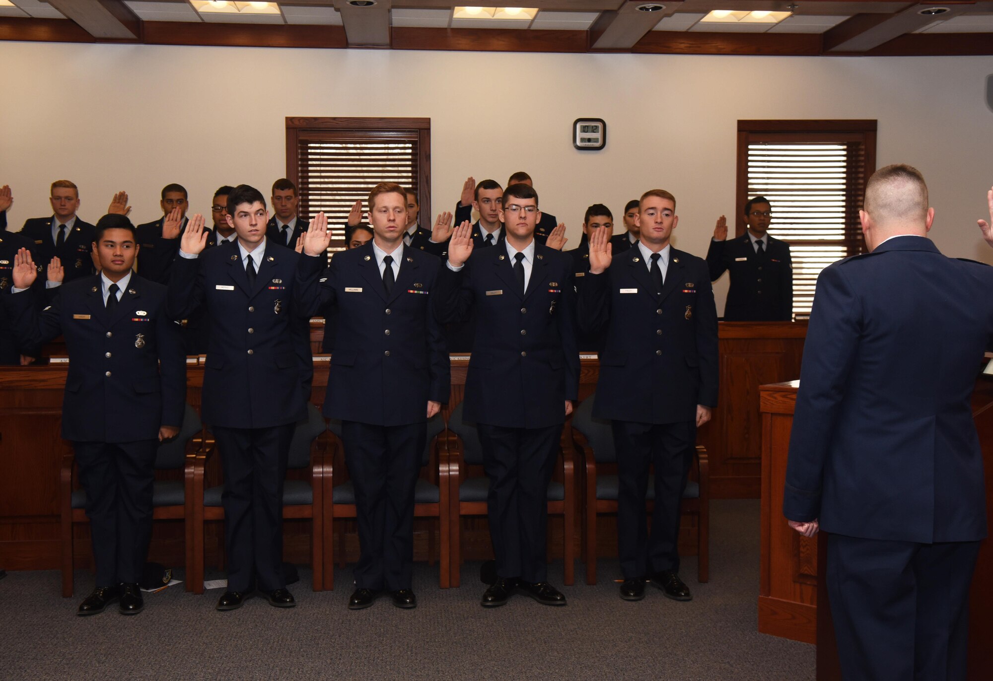 Capt. Charles Grimsley, 90th Missile Wing chief of general law, leads the jury of first term Airmen in an oath during a mock trial at F.E. Warren Air Force Base, Wyo., Dec. 16, 2016. The legal office recently initiated this program for first term Airmen. “Got Consent” is designed to confront participants with the consequences of sexual assault from various perspectives. (U.S. Air Force photo by Airman 1st Class Breanna Carter) 