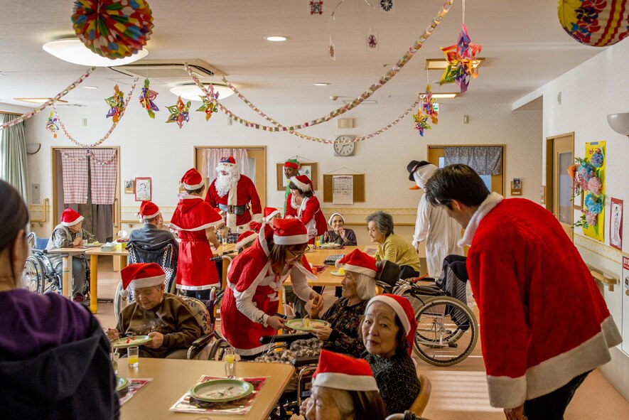 Yokota Air Base volunteers bring holiday cheer to residents of the Fussa Kotobuki Garden Nursing Home during a Christmas Eve visit on Dec. 24, 2016, in Fussa, Tokyo, Japan. Many of the Kotobuki Garden Nursing Home residents formally worked on Yokota Air Base. (U.S. Air Force photo by Airman 1st Class Donald Hudson)
