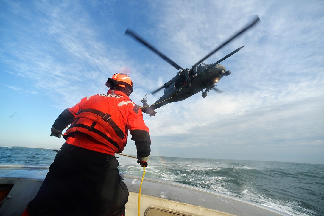 Airmen participate in hoist training with Coast Guardsmen in Hampton Bays, N.Y., Dec. 22, 2016. The airmen are assigned to the 101st and 103rd Rescue squadrons. The Coast Guardsmen are assigned to Coast Guard Station Shinnecock. Air National Guard photo by Staff Sgt. Christopher S. Muncy