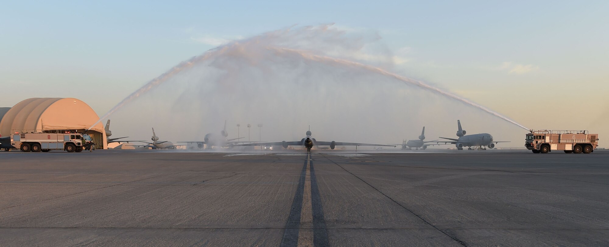 After the final sortie for one of the U-2 mission systems the aircraft passes under a water shower, a traditional way of celebrating major milestones or final flights, provided by the 380th Expeditionary Civil Engineering Squadron Fire Department at an undisclosed location in Southwest Asia, Dec. 15, 2016. A system that is already in use on the RQ-4 will replace the retired system, enabling both aircraft to continue providing complimentary high-altitude intelligence, surveillance and reconnaissance products. (U.S. Air Force photo by Tech. Sgt. Christopher Carwile)