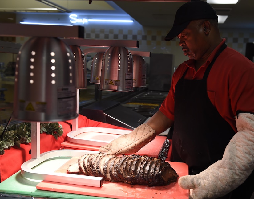Kenneth Kelly, 628th Force Support Squadron dining facility shift supervisor, sets out prime rib for Christmas dinner at the Gaylor Dining Facility Dec. 25, 2016. The dining facility began preparing for the Christmas dinner during the Thanksgiving holiday.