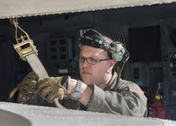 Master Sgt. Bryan Muise, 709th Airlift Squadron loadmaster, straps down the wings of the Fairchild C-119B Flying Boxcar #48-0352 “Am Can Co Special” inside a C-5M Super Galaxy Dec. 19, 2016, at Edwards Air Force Base, Calif. This C-119 was destined to be sold for scrap metal had it not been rescued by the Air Mobility Command Museum. (U.S. Air Force photo by Senior Airman Zachary Cacicia)