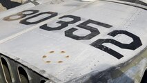 The tail markings on the tail section of the Fairchild C-119B Flying Boxcar #48-0352 “Am Can Co Special” Dec. 17, 2016, at Edwards Air Force Base, Calif. C-119s were built at Fairchild’s Hagerstown, Md. Factory. (U.S. Air Force photo by Senior Airman Zachary Cacicia)