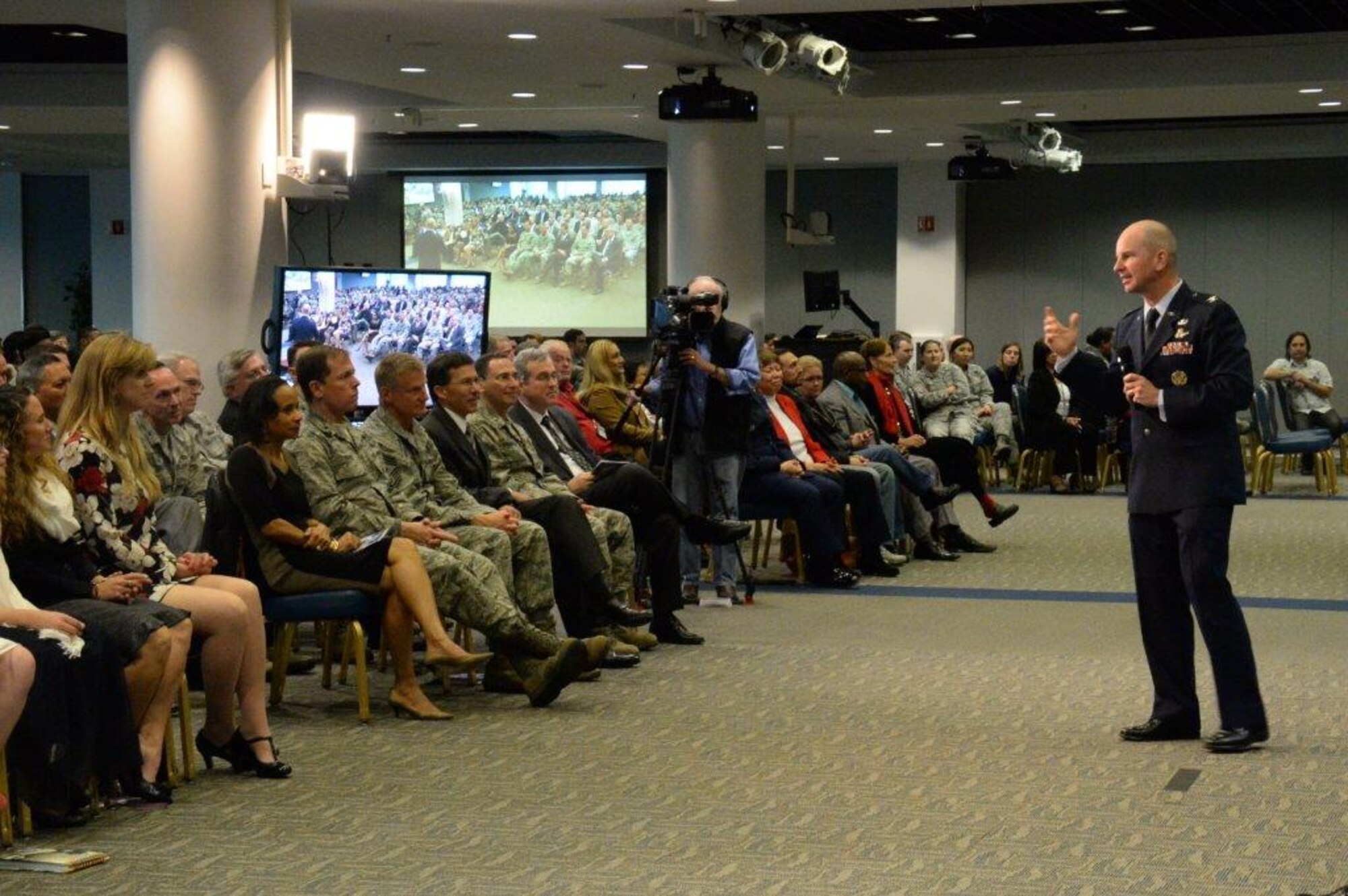 Col. Dennis Bythewood addresses an audience of family members and Space and Missile Systems Center personnel after assuming command of the Remote Sensing Systems Directorate Dec. 19, during a change of leadership ceremony in the Gordon Conference Center of the Schriever Space Complex at Los Angeles Air Force Base in El Segundo, Calif. (U.S. Air Force photo/Van De Ha)