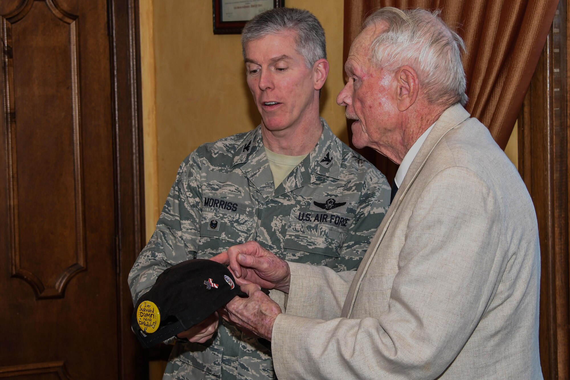 U.S. Air Force Col. James Morriss III, 307th Bomb Wing vice-commander, speaks with Ken Darnell, a veteran of the U.S. Army 65th Infantry Regiment, during a luncheon honoring veterans of the Battle of Chosin Reservoir Dec. 22, 2016 at Barksdale Air Force Base, La.   The battle was part of the Korean conflict in which American forces had been surrounded by enemy troops.    The veterans are being honored this week at the Independence Bowl. (U.S. Air Force photo by Tech. Sgt. Ted Daigle/Released)