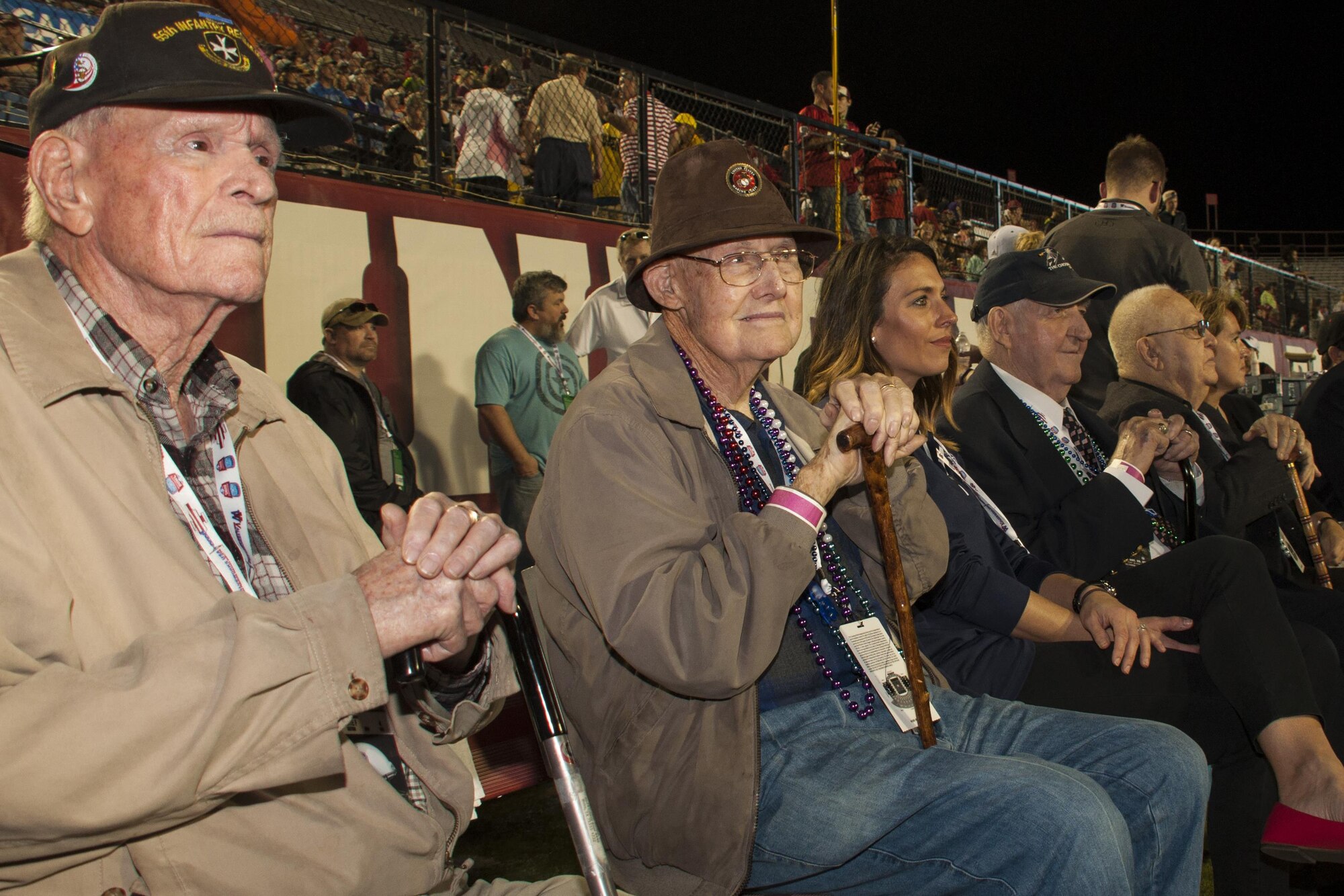 Veterans of the Battle of Chosin Reservoir enjoy the halftime show at the Camping World Independence Bowl just prior to taking the field to accept the Omar Bradley Spirit of Independence Award Dec. 26, 2016 in Shreveport, La.    The Battle of Chosin Reservoir took place during the Korean conflict when communist forces tried to overwhelm American troops.   Cutoff from other friendly forces and facing supply shortages and brutal cold, the Americans fought their way to safety.  In the process, they inflicted heavy casualties on the enemy.  (U.S. Air Force photo by Tech. Sgt. Ted Daigle/ Released) 