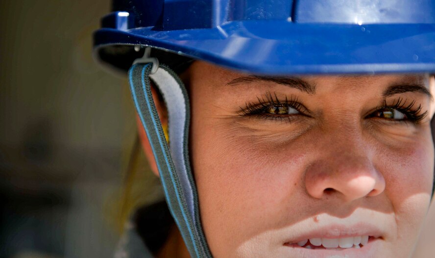 Airman 1st Class Karen, 432nd Maintenance Squadron munitions flight crew member, observes a munitions movement March 1, 2016 at Creech Air Force Base, Nevada. Karen is wearing personal protective equipment to meet safety requirements while participating in the move. (U.S. Air Force photo by Airman 1st Class Kristan Campbell/Released)