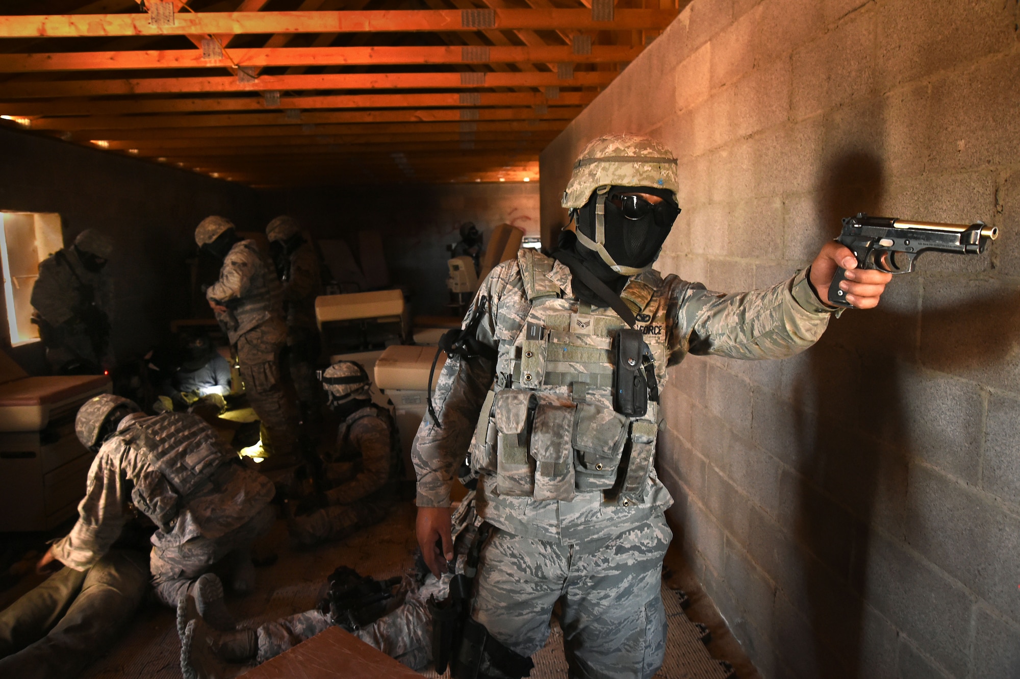 An Airman assigned to the 799th Security Forces Squadron defends his unit’s position from opposing forces during the field training exercise of a Fundamentals of Proficiency Fire and Close Quarters Battle course, Oct. 21, 2016, at Range 63C, Silver Flag Alpha, Nev. Airmen were tested and evaluated in combat tactics, strategic planning, communication and leadership through various training scenarios. (U.S. Air Force photo by Airman 1st Class James Thompson)  