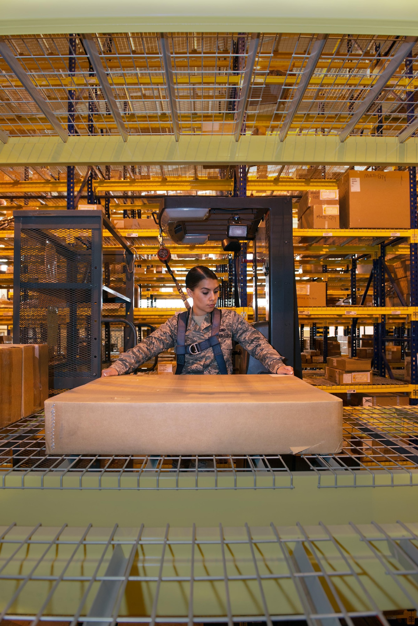 Airman 1st Class Megan Aguilar, 60th Logistics Readiness Squadron aircraft parts store, retrieves assets from bin row.   (U.S. Air Force photo by Louis Briscese)