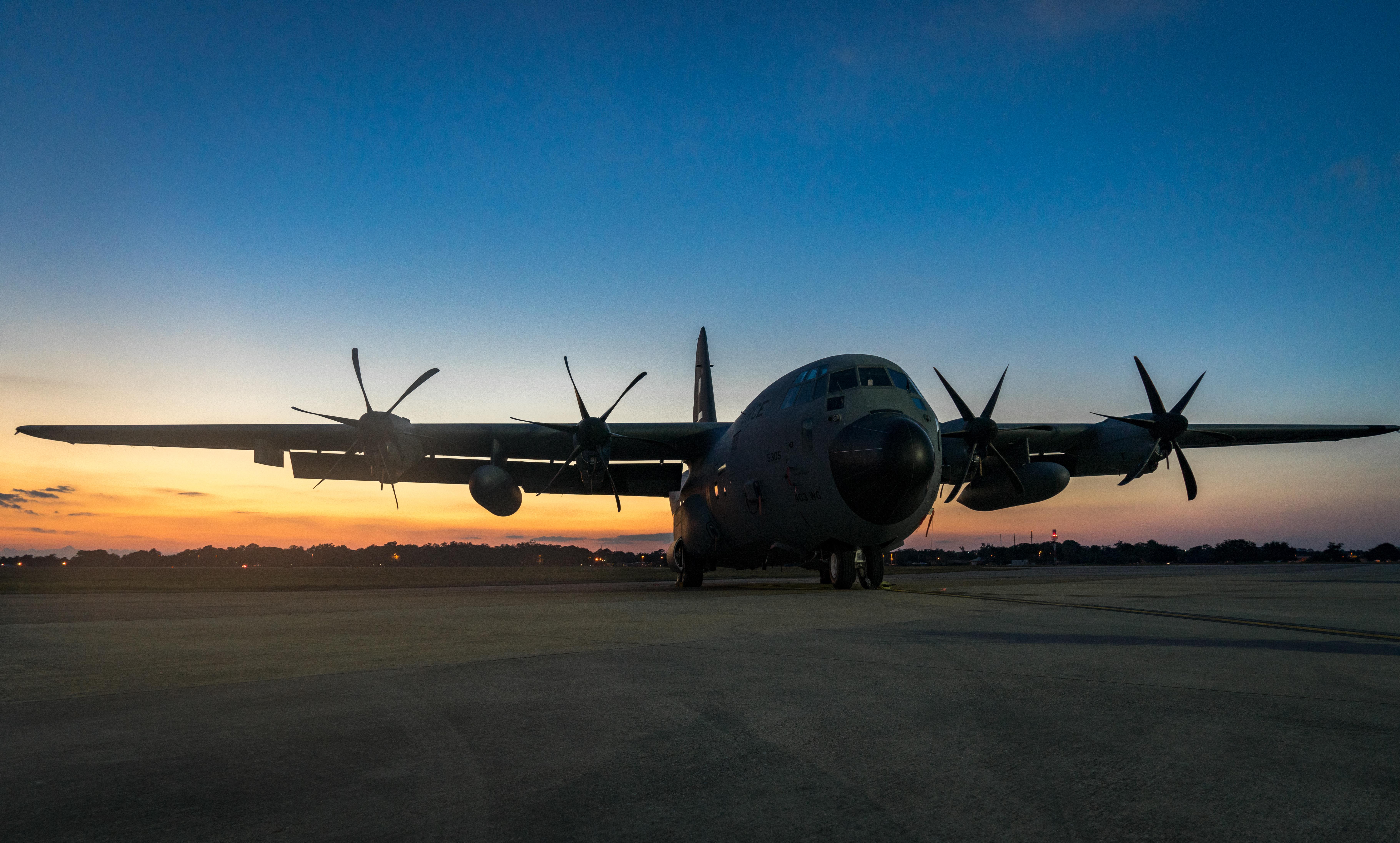 A 403rd Wing WC-130J Super Hercules aircraft is parked on the Keesler Air Force Base flight line as the sun sets. (U.S. Air Force photo/Staff Sgt. Shelton Sherrill)